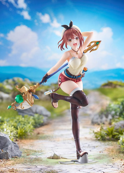 A 1/7 scale figure of Reisalin 'Ryza' Stout from Atelier Ryza, styled in a 'Summer Adventure!' version, standing on one leg with a cheerful expression, dressed in an adventurer's outfit with a magical staff in hand.