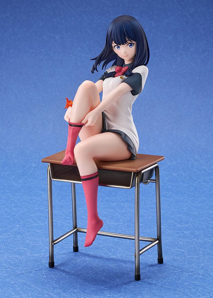 Gridman Universe Rikka Takarada (Daily School Life Ver.) 1/7 Scale Figure seated on school desk in relaxed pose with school uniform and pink socks