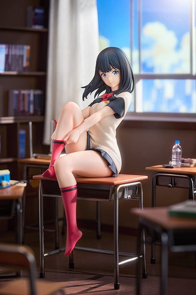 Gridman Universe Rikka Takarada (Daily School Life Ver.) 1/7 Scale Figure seated on school desk in relaxed pose with school uniform and pink socks