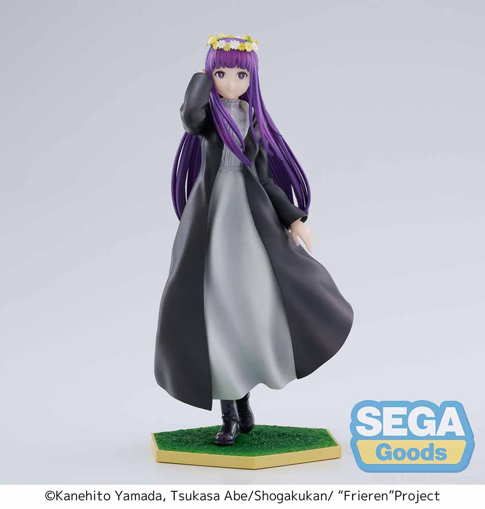 Frieren: Beyond Journey's End Luminasta Fern (Flower Garden) Figure featuring Fern in a long black coat, gray dress, and daisy crown on a grass-textured hexagonal base, set against a white background.