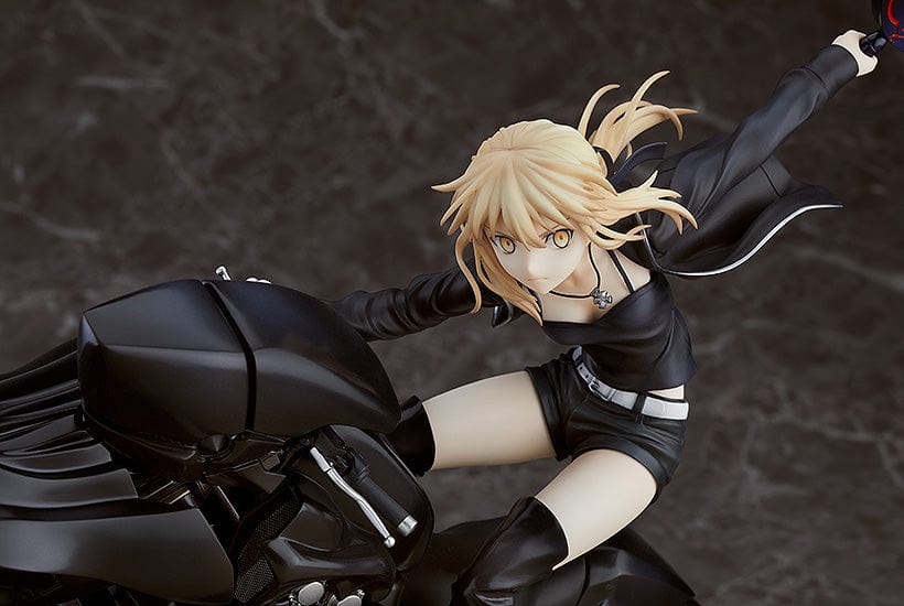 A 1/8 scale figure of Saber/Altria Pendragon (Alter) from Fate/Grand Order, astride her motorcycle Cuirassier Noir, in a reissued collector's edition. The figure features the dark-armored Saber with her crimson eyes and Excalibur sword, exuding a formidable presence while her black motorcycle boasts intricate mechanical details, capturing the blend of medieval and modern elements iconic to the character's Alter version.