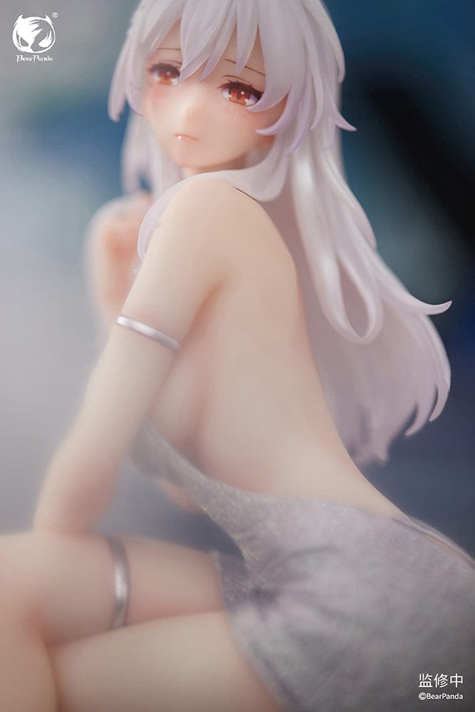 "Serina 1/6 Scale Figure (With Bonus) - Elegant figure of Serina with long white hair, seated gracefully on a stylish chair, wearing a shimmering silver dress and delicate accessories."