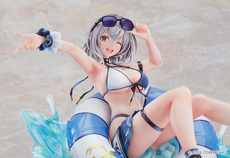 Hololive Production Shirogane Noel (Swimsuit Ver.) 1/7 Scale Figure lounging on float ring with water splash effects, in playful beach pose