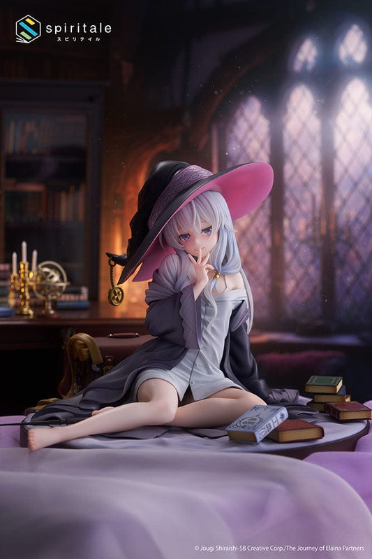 Spiritale Wandering Witch: The Journey of Elaina 1/6 Scale Figure - Elaina (Rest Ver.), depicting Elaina in a thoughtful pose, sitting among scattered books, wearing her signature wide-brimmed hat and detailed mage's outfit.