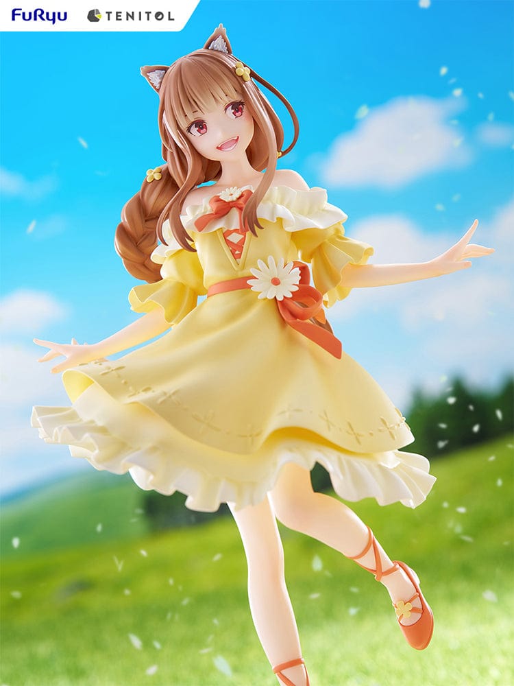 Spice and Wolf Tenitol Holo figure, featuring Holo in a joyful pose wearing a flowing yellow dress with wolf ears and tail, standing on a decorative base.