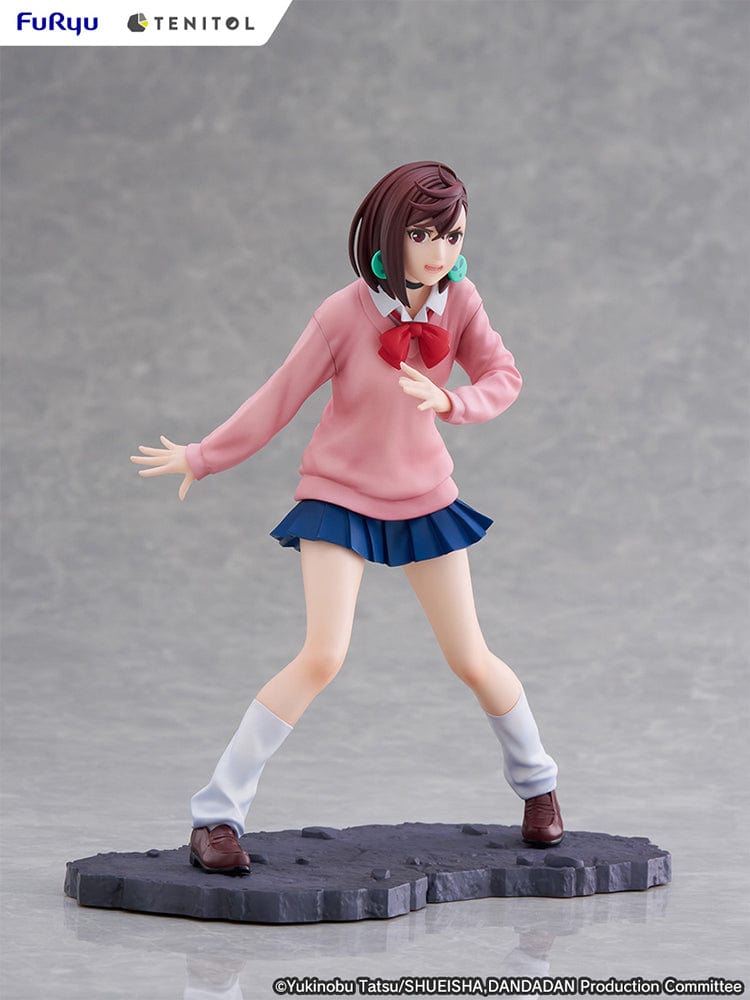 Dandadan Tenitol Momo Ayase Figure in school uniform with pink sweater and red ribbon, standing in action pose on rugged base.