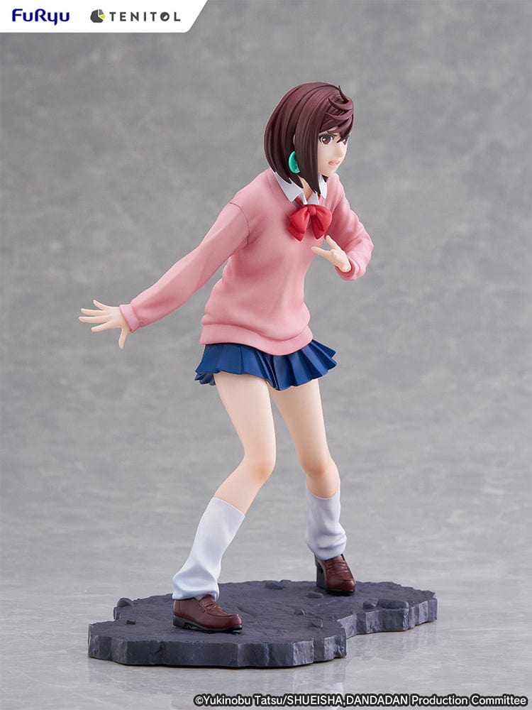 Dandadan Tenitol Momo Ayase Figure in school uniform with pink sweater and red ribbon, standing in action pose on rugged base.