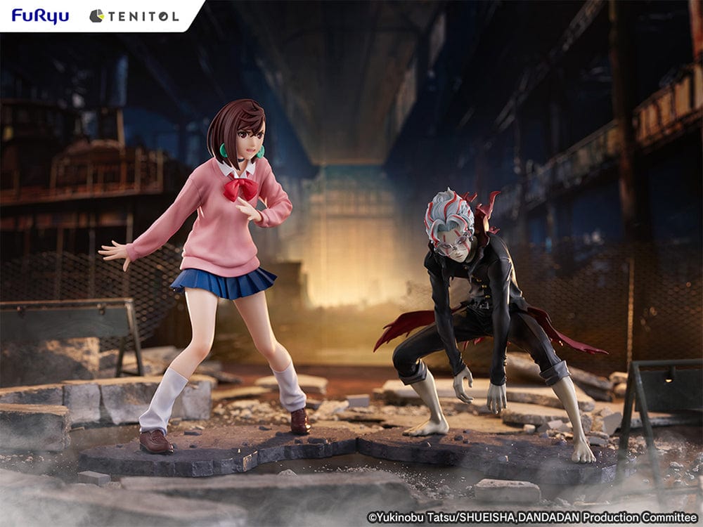 Dandadan Tenitol Momo Ayase Figure in school uniform with pink sweater and red ribbon, standing in action pose on rugged base.