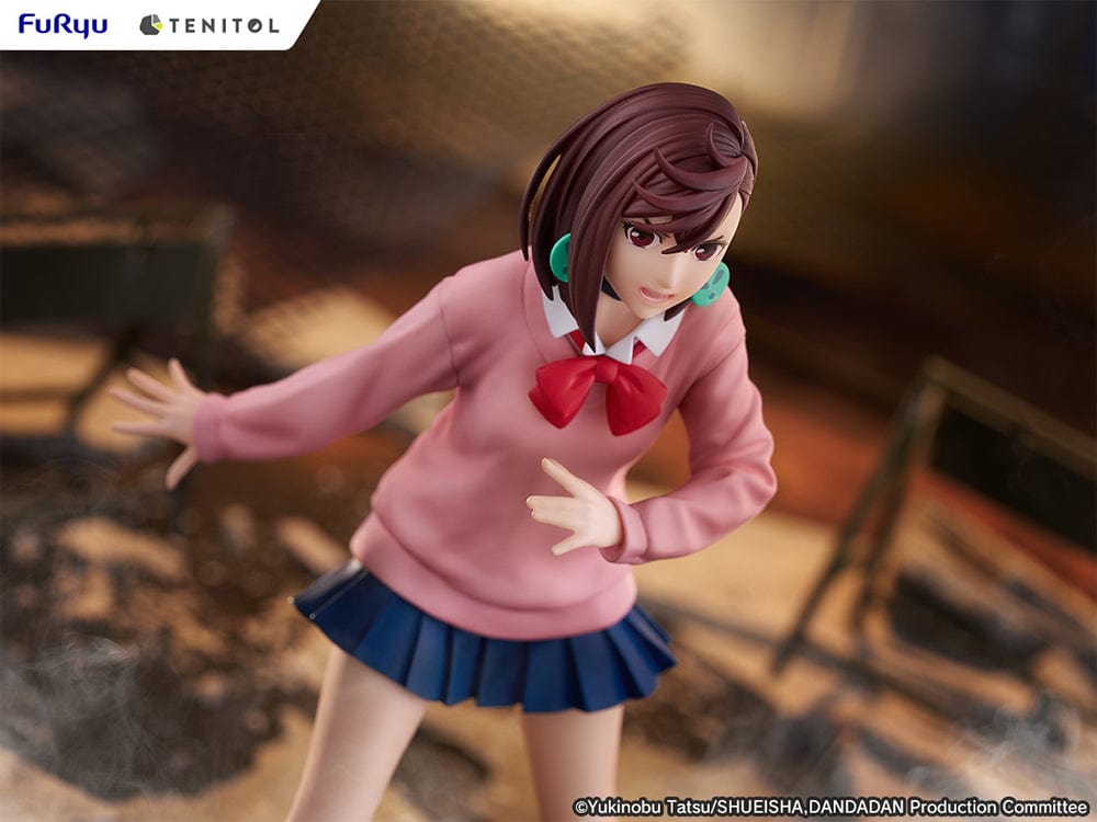 Dandadan Tenitol Momo Ayase Figure in school uniform with pink sweater and red ribbon, standing in action pose on rugged base.