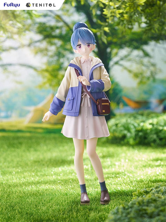 Laid-Back Camp Tenitol Rin Shima Figure - Detailed anime figure of Rin Shima standing in a relaxed pose with blue hair tied up, wearing a blue and cream jacket, pink skirt, and carrying a brown shoulder bag, on a grassy base.
