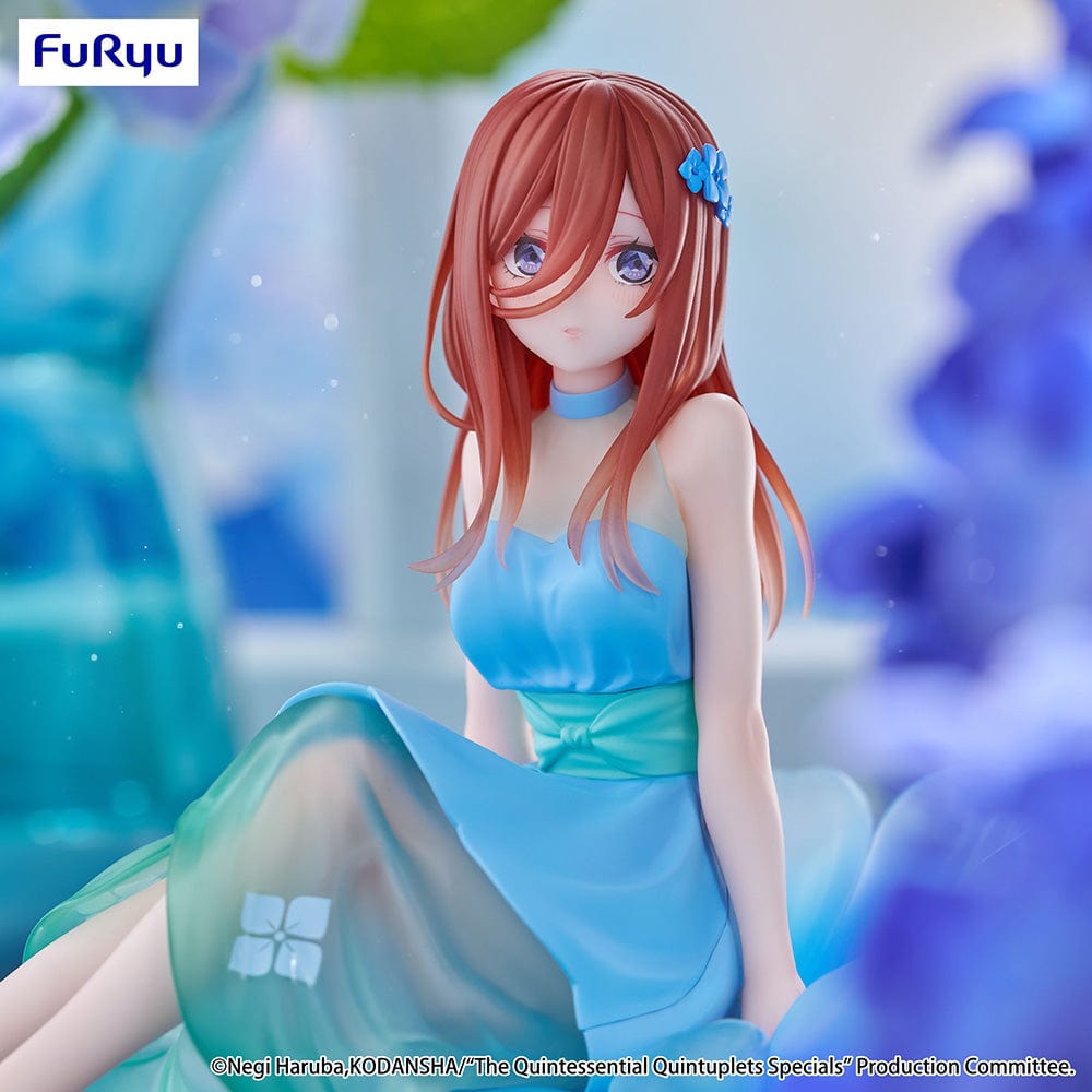 The Quintessential Quintuplets Bloo-me! Miku Nakano Figure, featuring Miku in a pastel blue floral dress, seated gracefully on a petal-like base with a serene expression and intricate detailing.