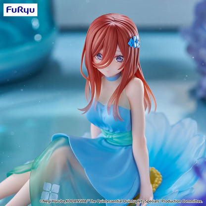 The Quintessential Quintuplets Bloo-me! Miku Nakano Figure, featuring Miku in a pastel blue floral dress, seated gracefully on a petal-like base with a serene expression and intricate detailing.