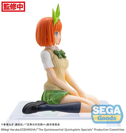 The Quintessential Quintuplets Yotsuba Nakano Premium Perching Figure, depicting Yotsuba in her signature outfit with bright orange hair and a cheerful smile, seated on a clear base.