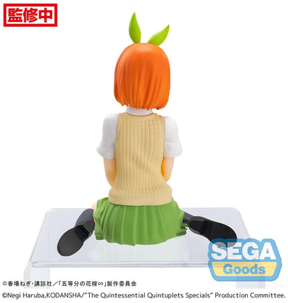 The Quintessential Quintuplets Yotsuba Nakano Premium Perching Figure, depicting Yotsuba in her signature outfit with bright orange hair and a cheerful smile, seated on a clear base.
