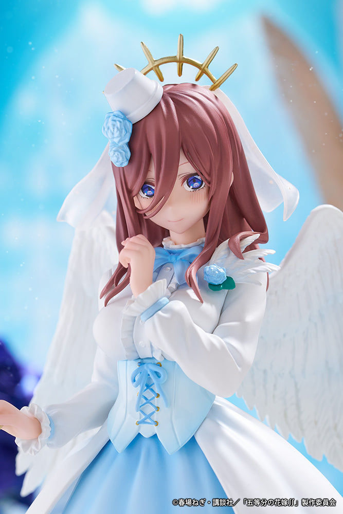 The Quintessential Quintuplets Miku Nakano (Angel Ver.) 1/7 Scale Figure, featuring Miku in an angelic outfit with delicate wings, standing on a blue rose base.
