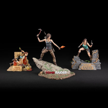 Tomb Raider Lara Croft (Survivor Era) Statue holding climbing axe and torch, in rugged survival gear on rocky base with foliage and skull