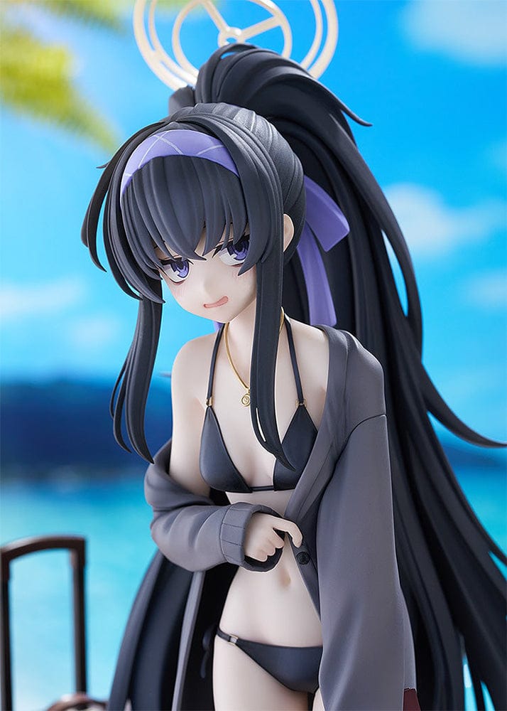 Blue Archive Ui (Swimsuit) 1/7 Scale Figure featuring Ui in a black swimsuit with an oversized jacket, long black hair, and detailed beach base with suitcase and stone pillar.