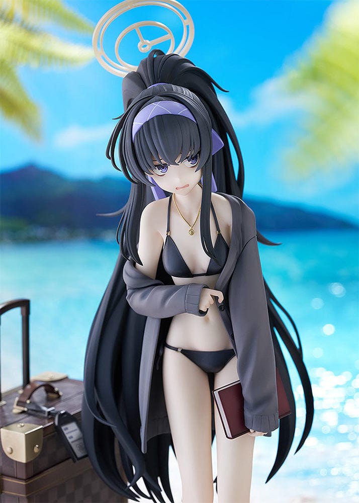 Blue Archive Ui (Swimsuit) 1/7 Scale Figure featuring Ui in a black swimsuit with an oversized jacket, long black hair, and detailed beach base with suitcase and stone pillar.