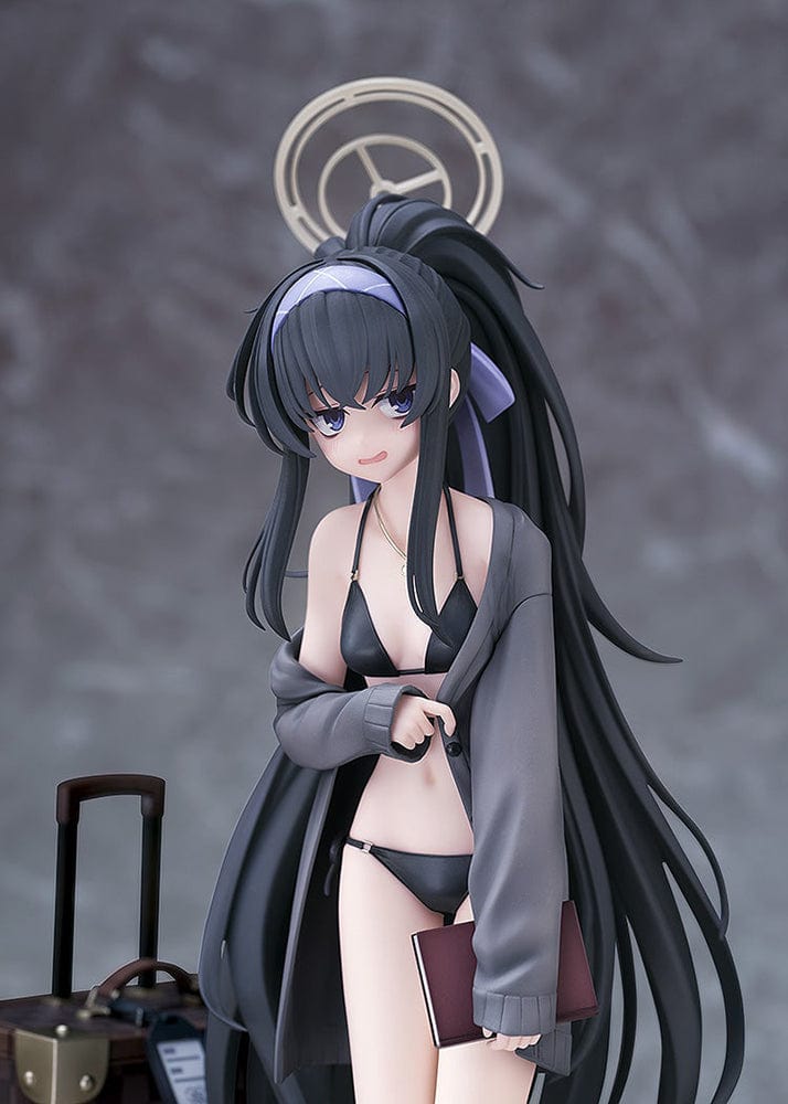 Blue Archive Ui (Swimsuit) 1/7 Scale Figure featuring Ui in a black swimsuit with an oversized jacket, long black hair, and detailed beach base with suitcase and stone pillar.