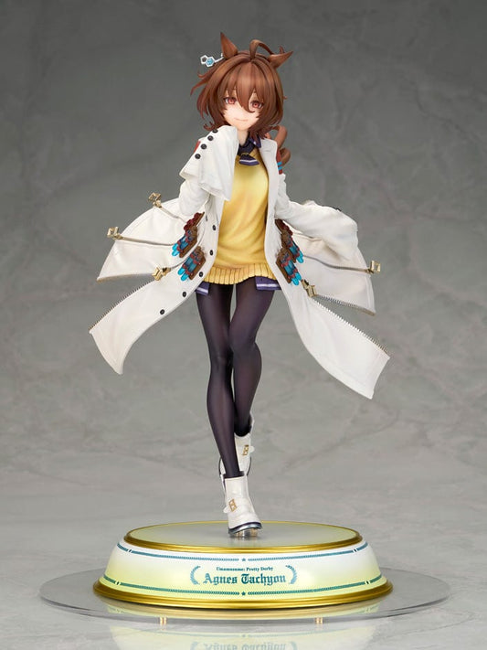 Uma Musume Pretty Derby Agnes Tachyon 1/7 Scale Figure with white lab coat and yellow sweater, standing on a gold-edged base.