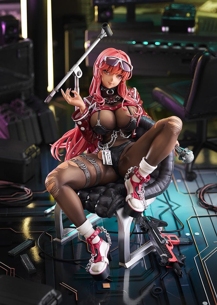 Goddess of Victory: Nikke Volume 1/7 Scale Figure seated on a chair, red hair cascading, sporting battle gear with intricate black and red details, and high-tech boots, holding a staff, embodying both beauty and strength.