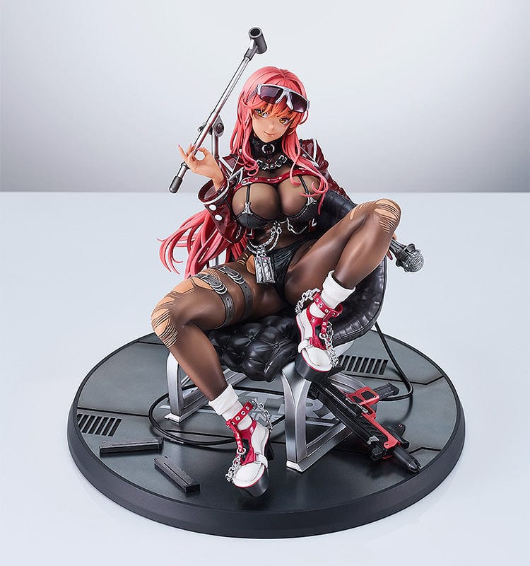 Goddess of Victory: Nikke Volume 1/7 Scale Figure seated on a chair, red hair cascading, sporting battle gear with intricate black and red details, and high-tech boots, holding a staff, embodying both beauty and strength.