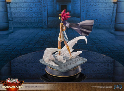 Yu-Gi-Oh! Pharaoh Atem Limited Edition Statue featuring the ancient ruler in his traditional regalia with headdress and flowing cape, perched on an Egyptian-themed pedestal, capturing his commanding presence in a finely detailed resin sculpture.