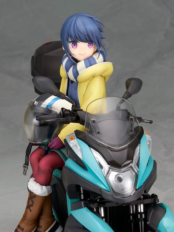 Laid-Back Camp Rin Shima 1/10 Scale Figure seated on a detailed turquoise three-wheeled scooter, wearing winter camping gear with a scarf and boots.