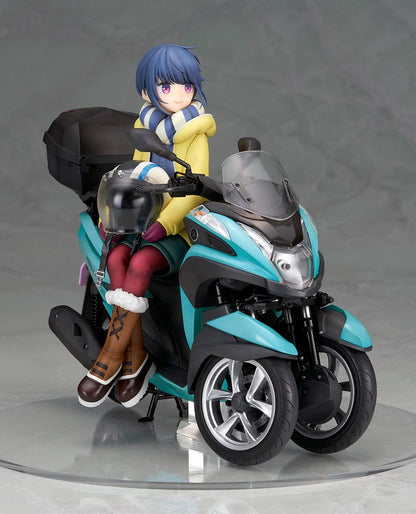 Laid-Back Camp Rin Shima 1/10 Scale Figure seated on a detailed turquoise three-wheeled scooter, wearing winter camping gear with a scarf and boots.