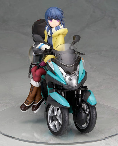 Laid-Back Camp Rin Shima 1/10 Scale Figure seated on a detailed turquoise three-wheeled scooter, wearing winter camping gear with a scarf and boots.