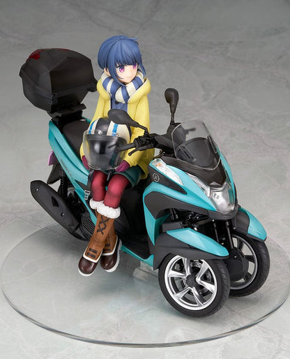 Laid-Back Camp Rin Shima 1/10 Scale Figure seated on a detailed turquoise three-wheeled scooter, wearing winter camping gear with a scarf and boots.