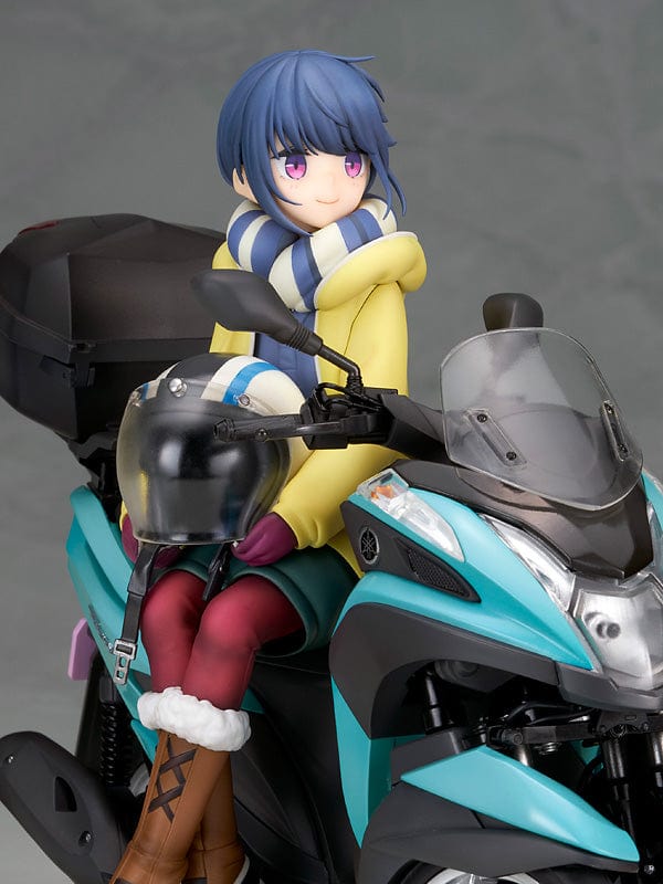 Laid-Back Camp Rin Shima 1/10 Scale Figure seated on a detailed turquoise three-wheeled scooter, wearing winter camping gear with a scarf and boots.