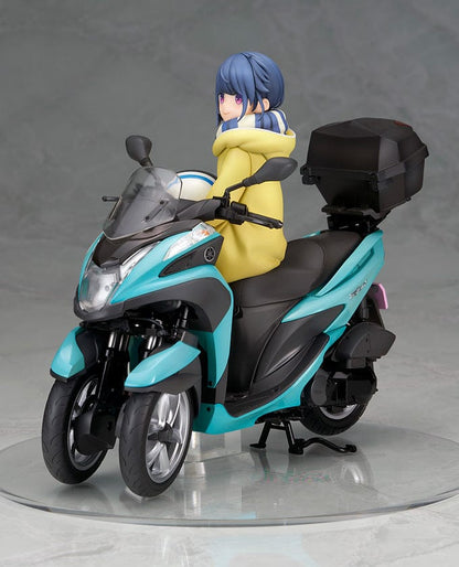 Laid-Back Camp Rin Shima 1/10 Scale Figure seated on a detailed turquoise three-wheeled scooter, wearing winter camping gear with a scarf and boots.