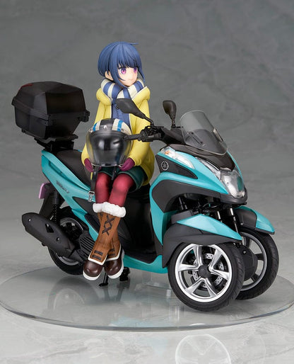 Laid-Back Camp Rin Shima 1/10 Scale Figure seated on a detailed turquoise three-wheeled scooter, wearing winter camping gear with a scarf and boots.