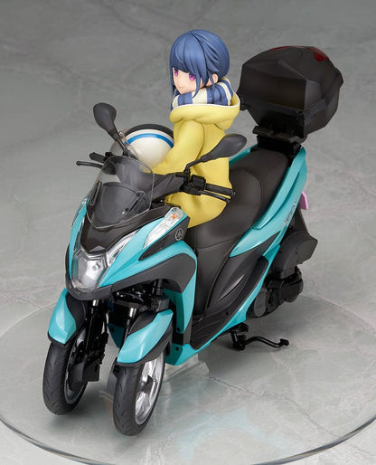 Laid-Back Camp Rin Shima 1/10 Scale Figure seated on a detailed turquoise three-wheeled scooter, wearing winter camping gear with a scarf and boots.